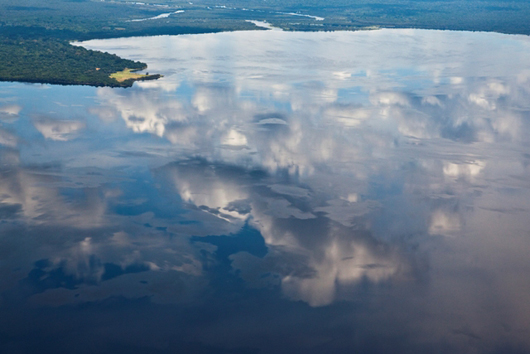 daniel beltra photo of clouds reflecting in water